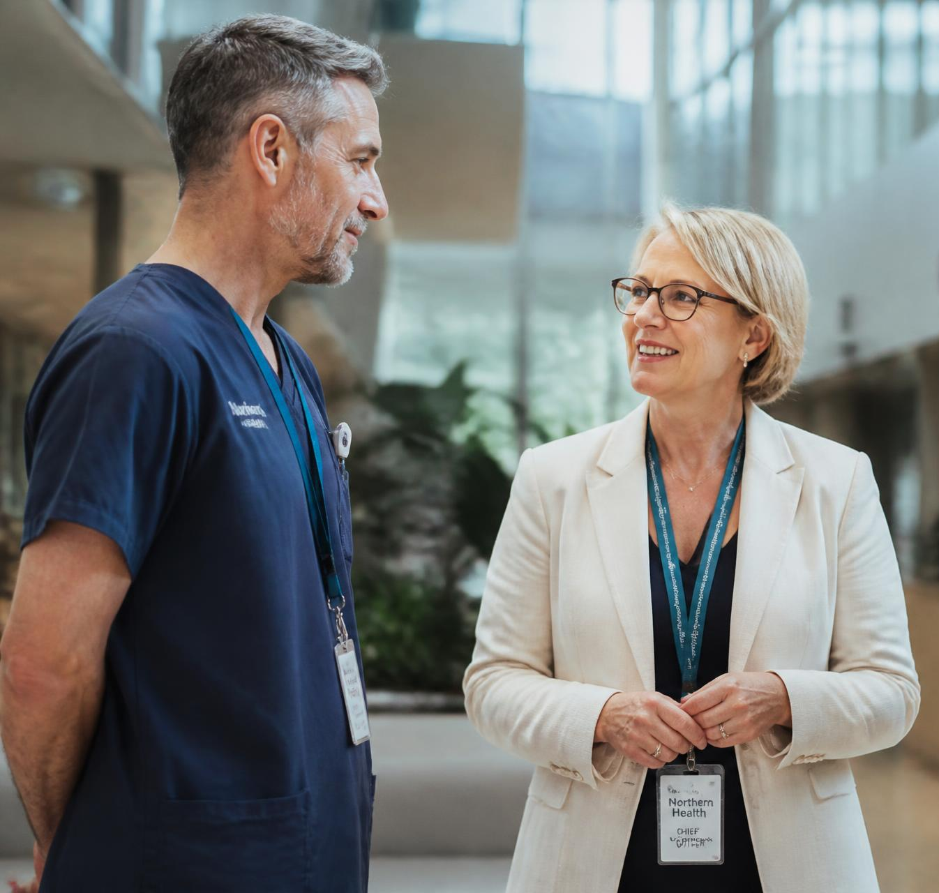 Healthcare leaders in conversation in a hospital